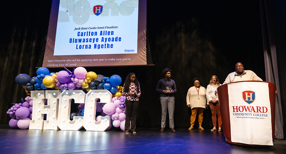Students standing on stage in Smith Theatre receiving awards