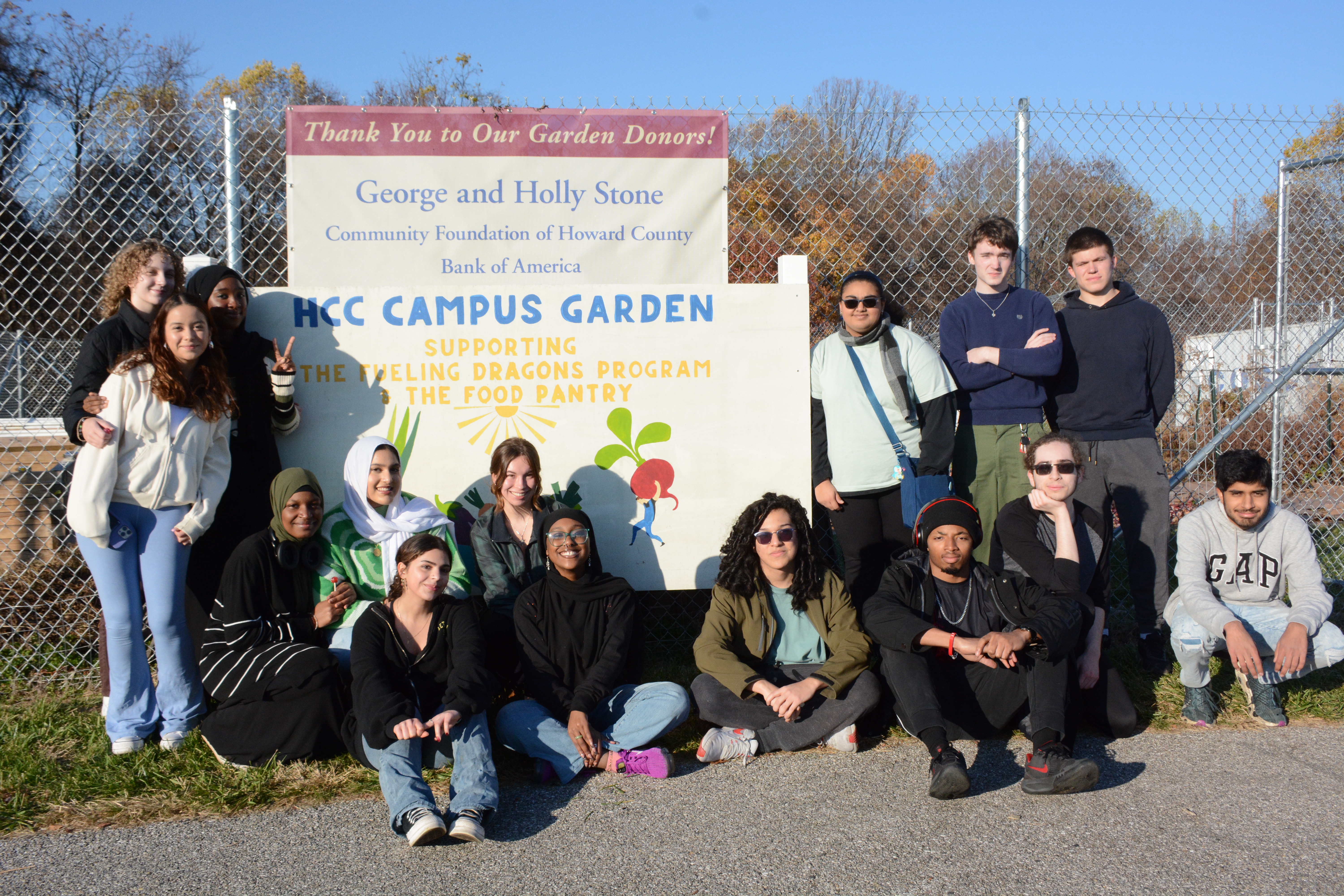 Several students in the HCC Campus Garden smiling.