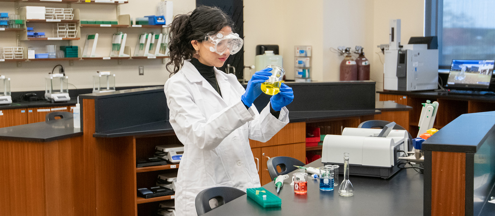 Valeria Monterroz in a science lab doing research.