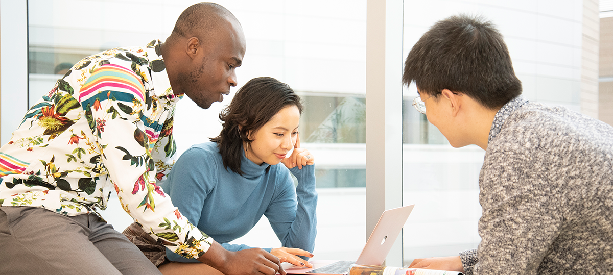Students studying together with a laptop computer