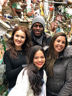 A group of 4 smiling students