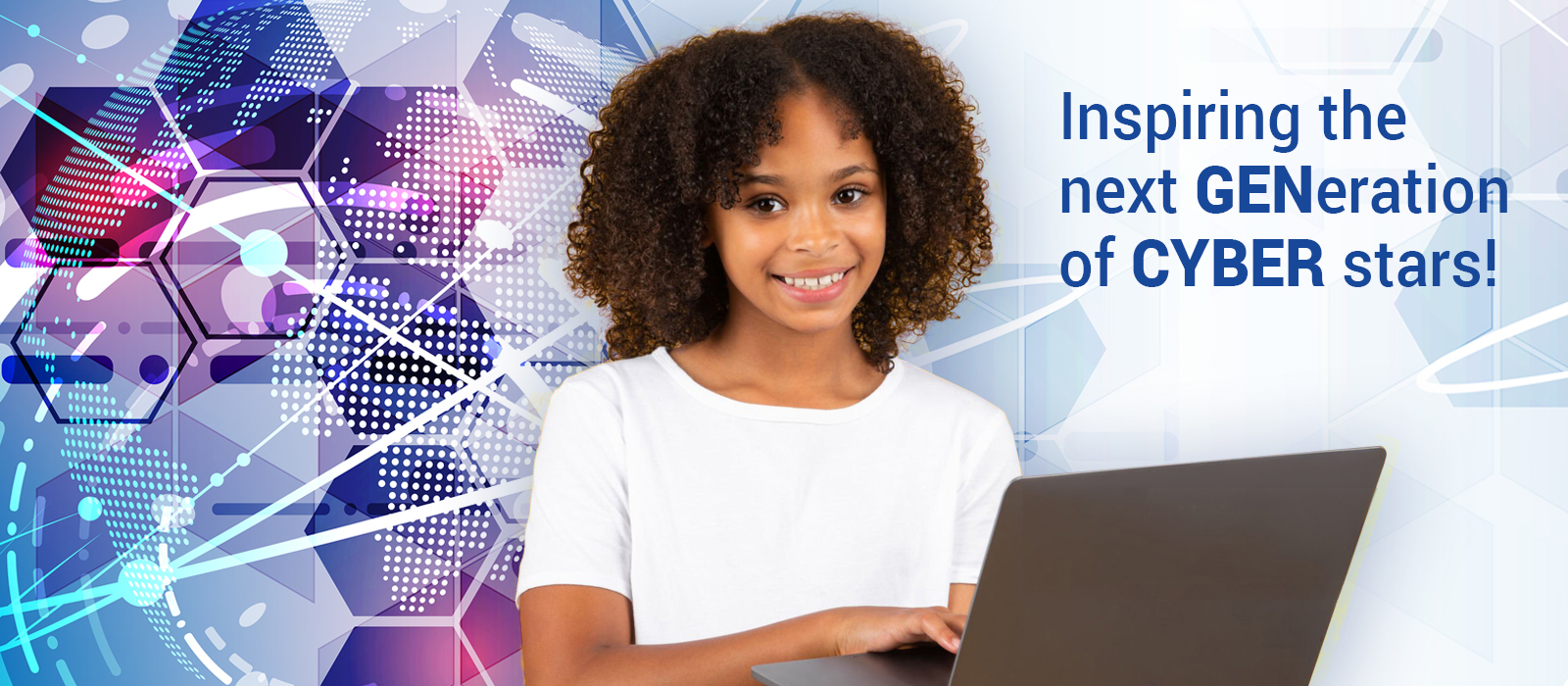 A young girl sitting at a computer