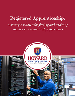 Registered Apprenticeship: A strategic solution for finding and retaining talented and committed professionals. Howard Community College logo overlaid on a photo of an IT professional working among computer servers.